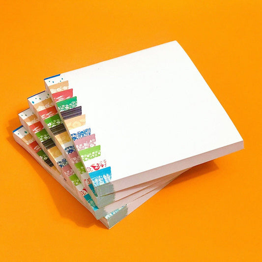 Stack of colorful sticky notes on an orange background