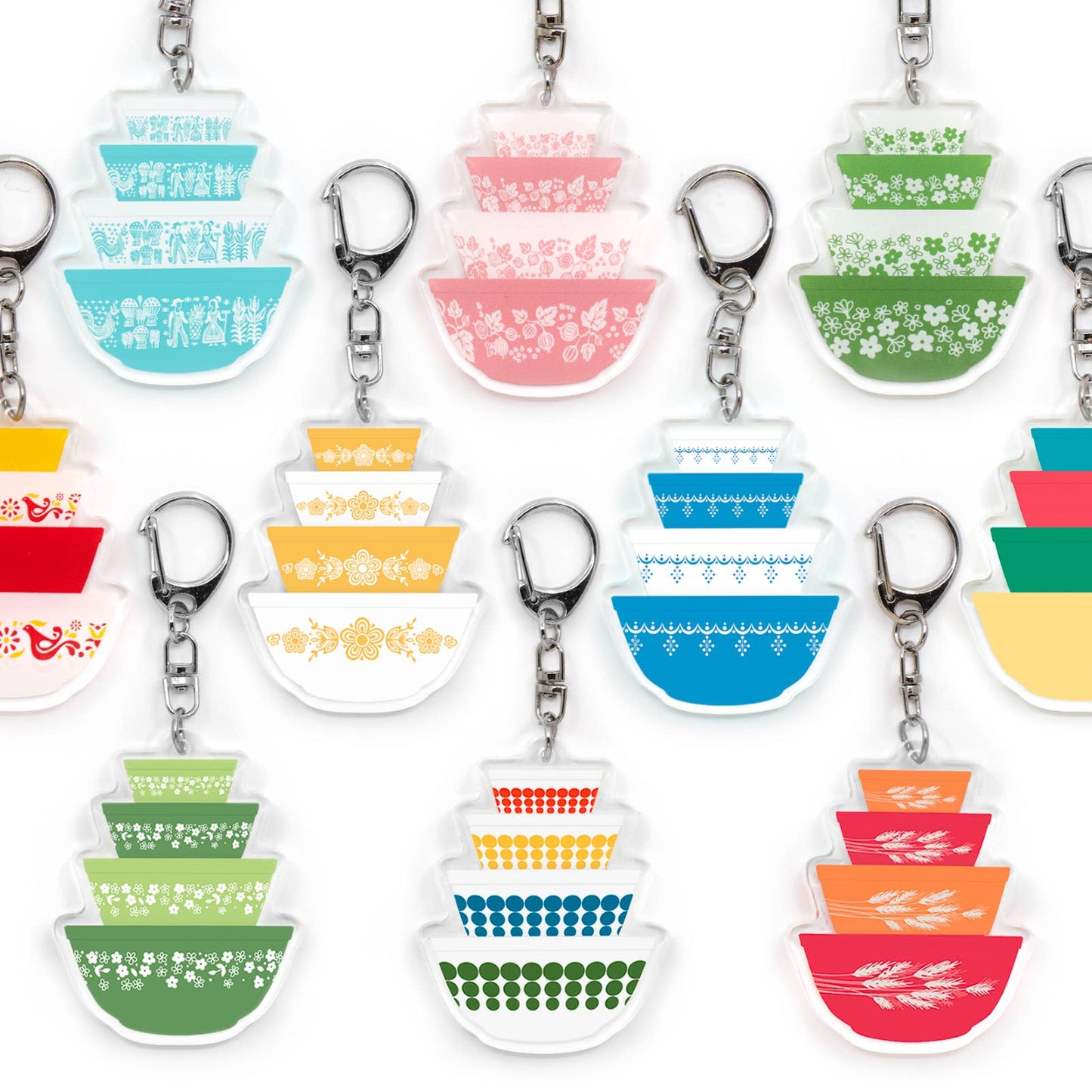 Set of colorful keychains with Pyrex-inspired patterned designs on a white background