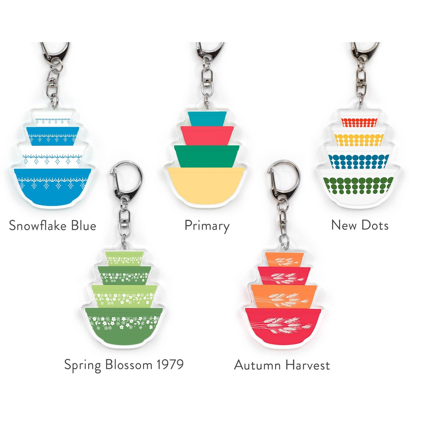 Set of colorful keychains with different patterns and color schemes on a white background.