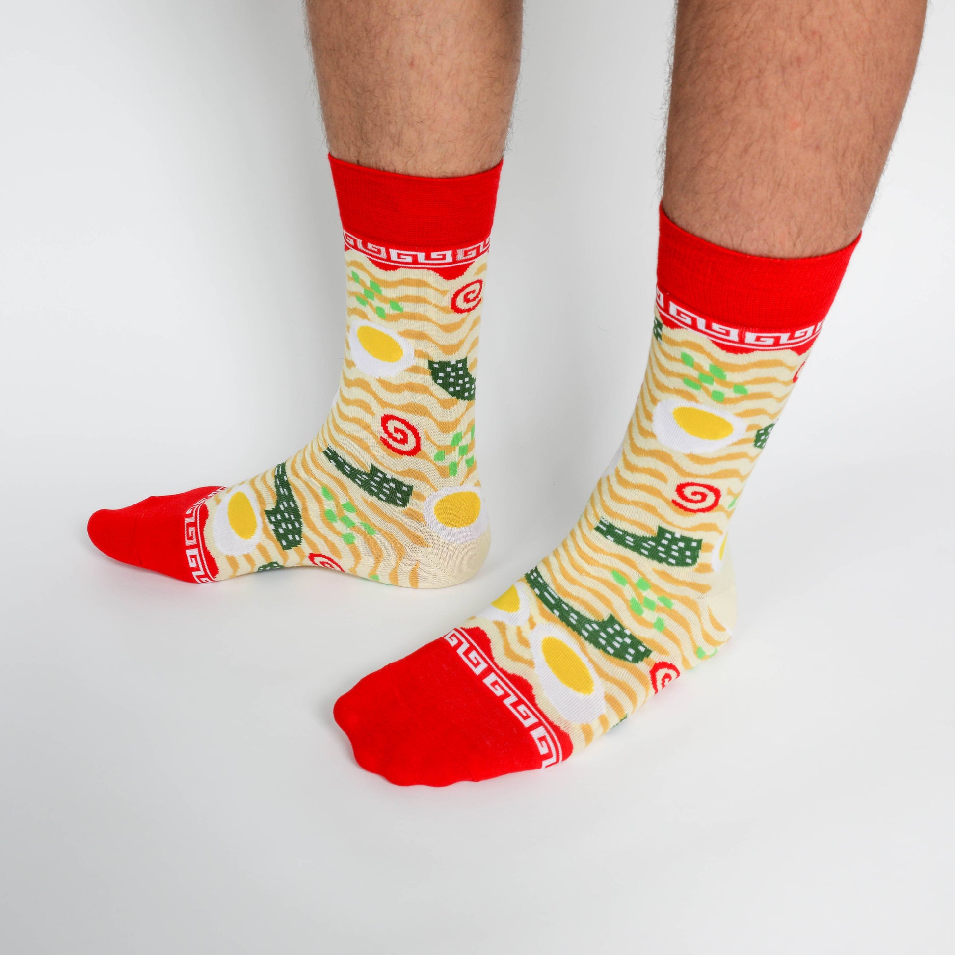 Colorful socks with a cartoonish design on a white background