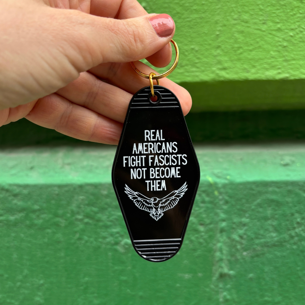 Real Americans Fight Fascists Not Become Them Motel Style Keychain in Black-GetBullish-The Bullish Store