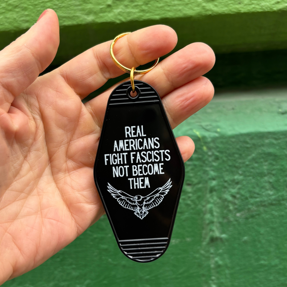 Real Americans Fight Fascists Not Become Them Motel Style Keychain in Black-GetBullish-The Bullish Store