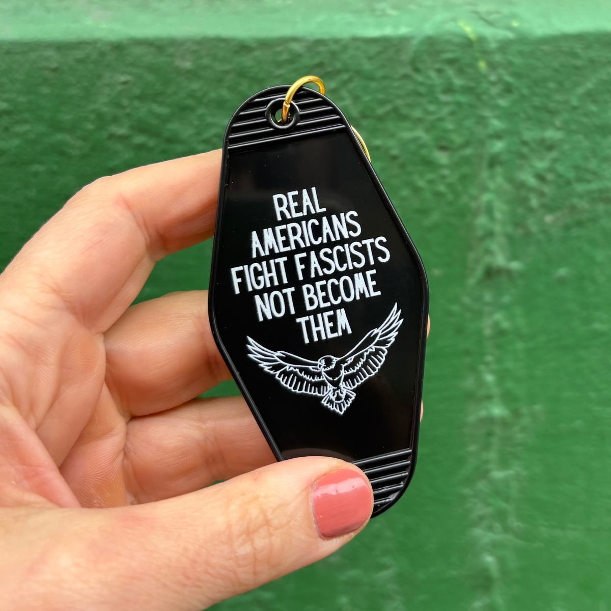 Real Americans Fight Fascists Not Become Them Motel Style Keychain in Black-GetBullish-The Bullish Store