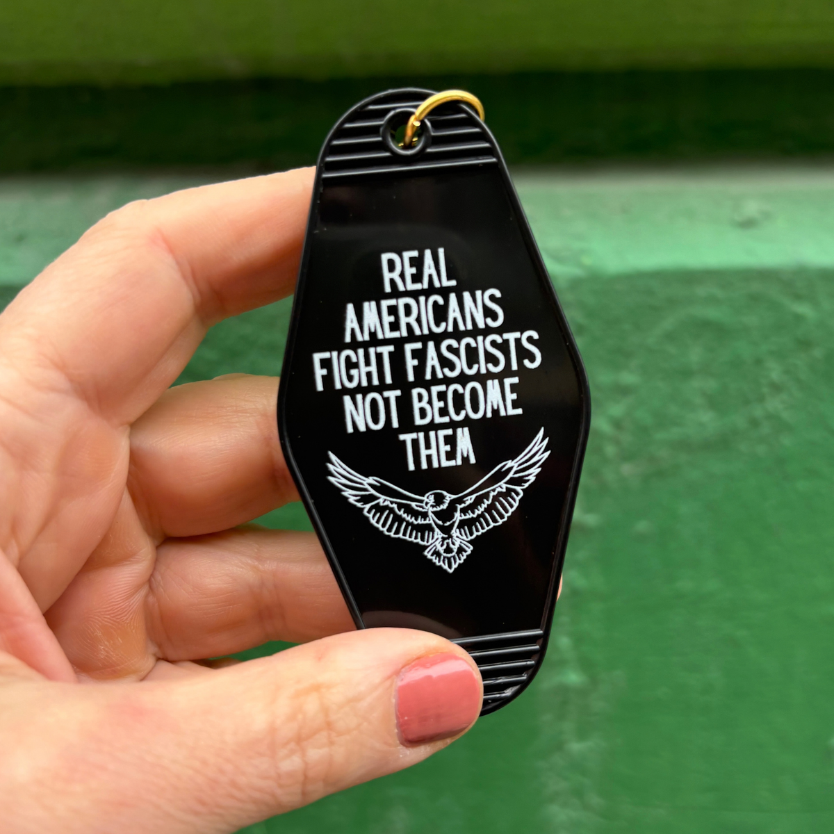 Real Americans Fight Fascists Not Become Them Motel Style Keychain in Black-GetBullish-The Bullish Store