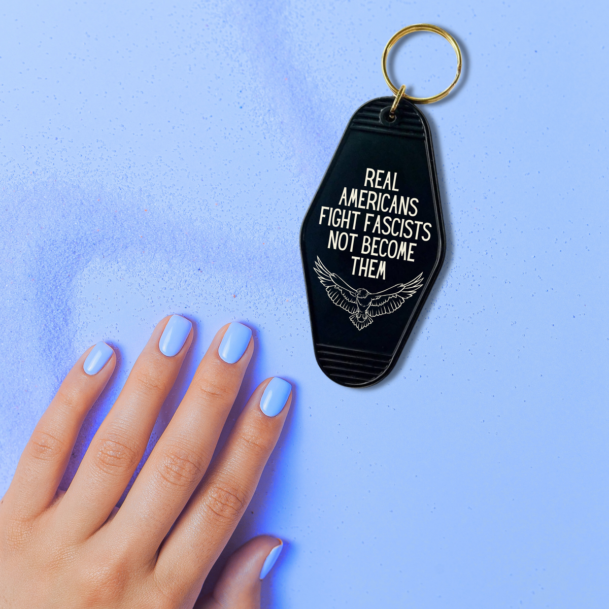 Real Americans Fight Fascists Not Become Them Motel Style Keychain in Black