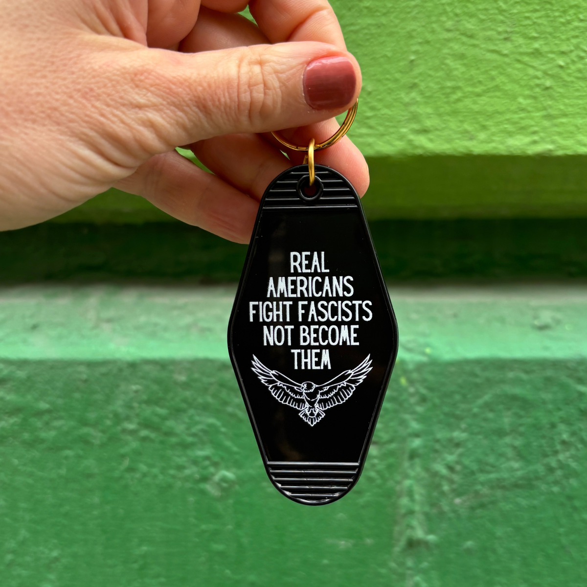 Real Americans Fight Fascists Not Become Them Motel Style Keychain in Black-GetBullish-The Bullish Store