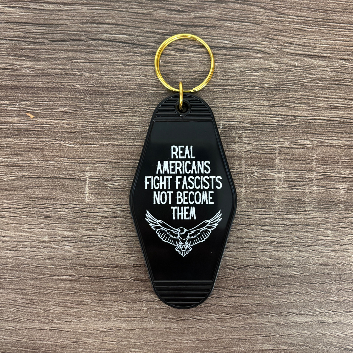 Real Americans Fight Fascists Not Become Them Motel Style Keychain in Black