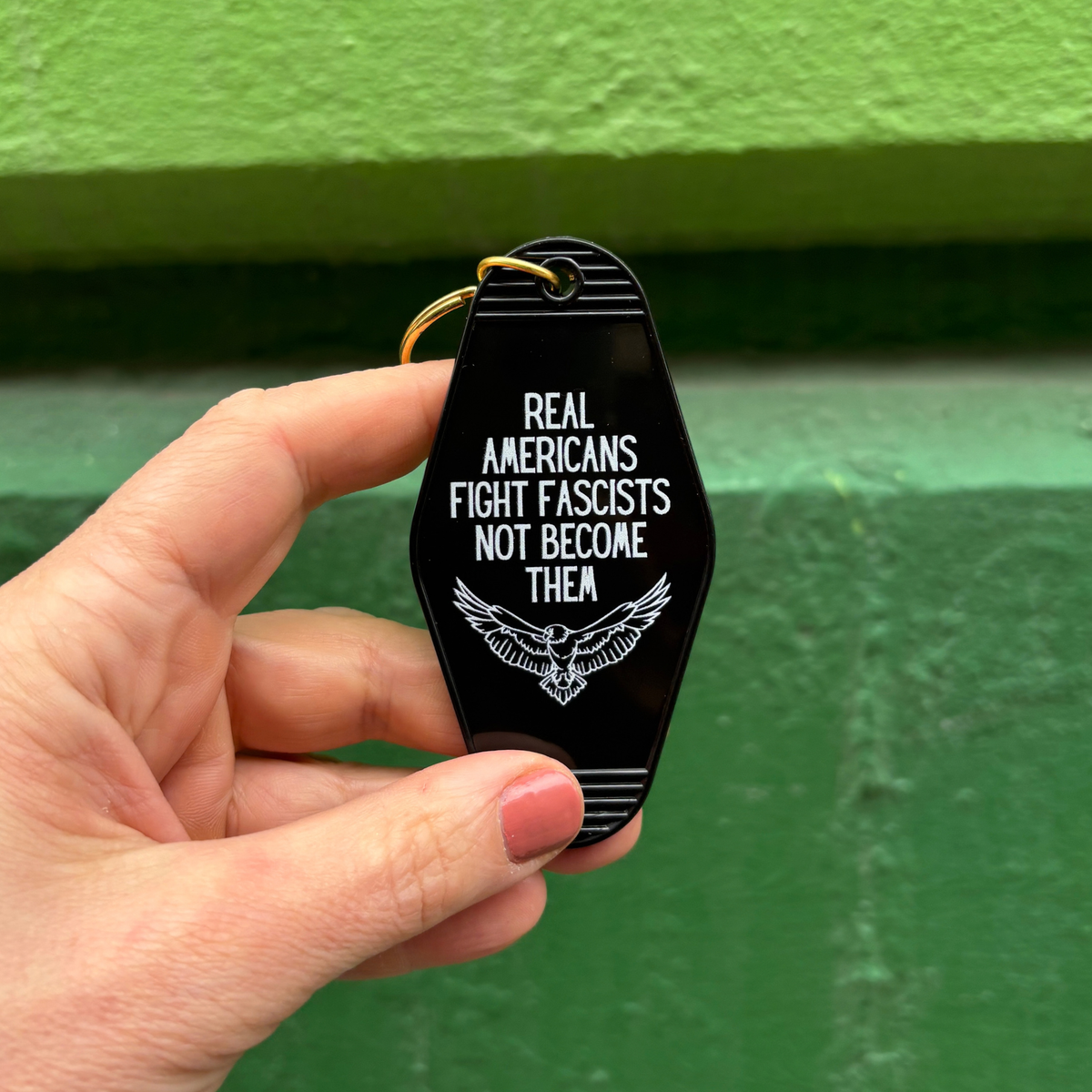 Real Americans Fight Fascists Not Become Them Motel Style Keychain in Black-GetBullish-The Bullish Store