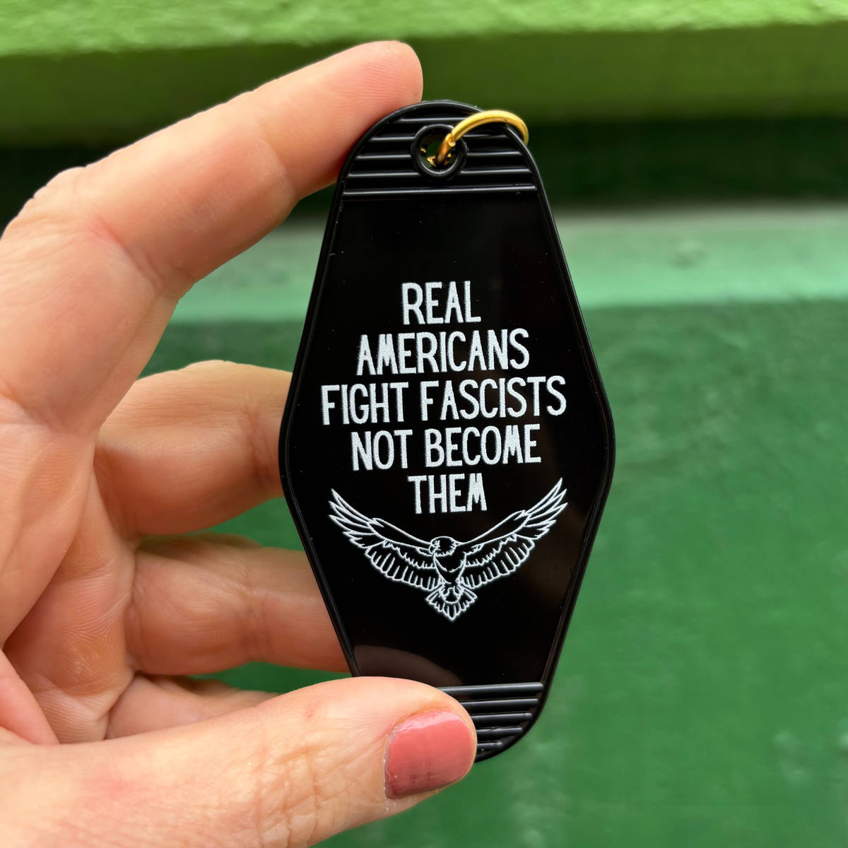 Real Americans Fight Fascists Not Become Them Motel Style Keychain in Black-GetBullish-The Bullish Store