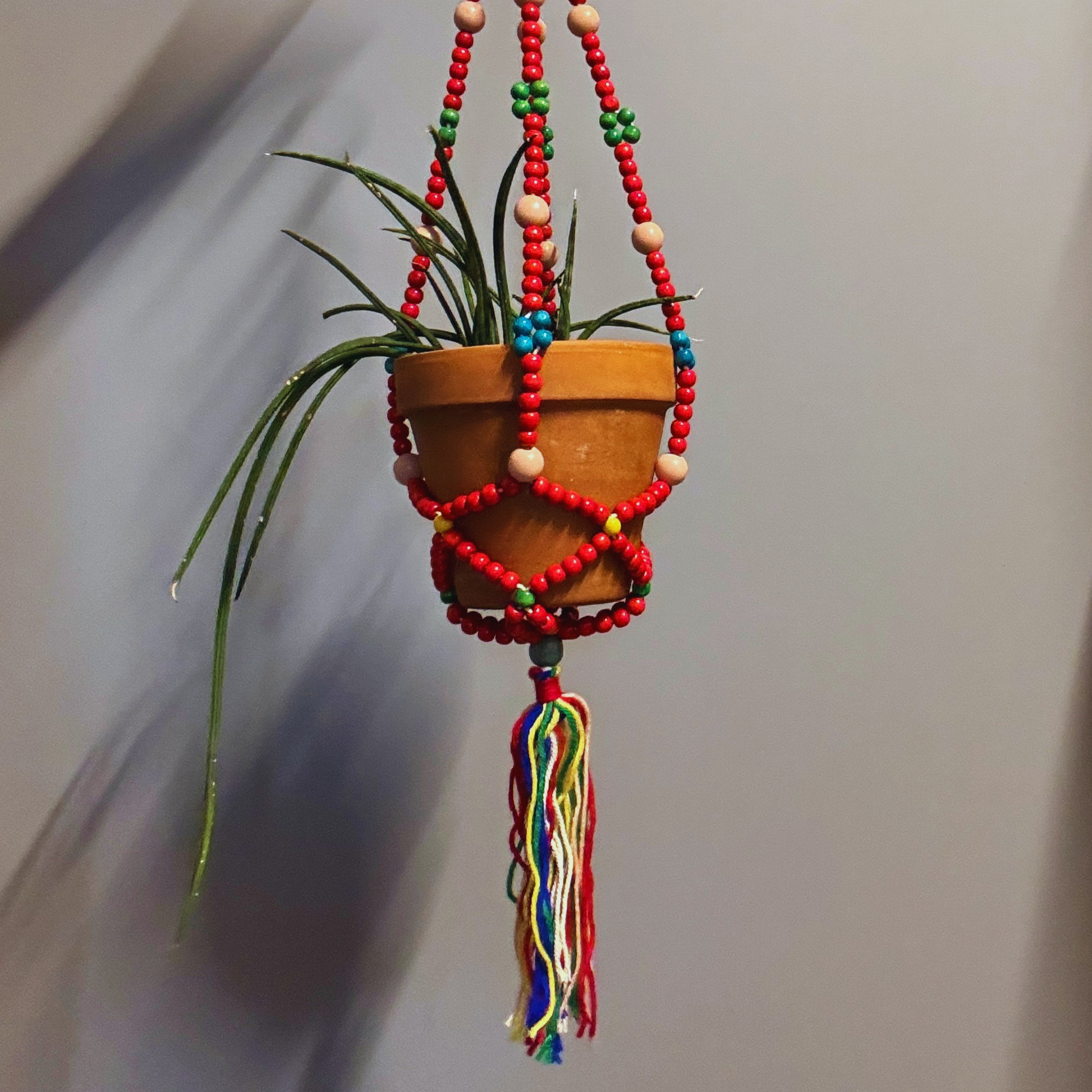 bohemian hanging planter 47th & Main Red Macrame Plant Holder