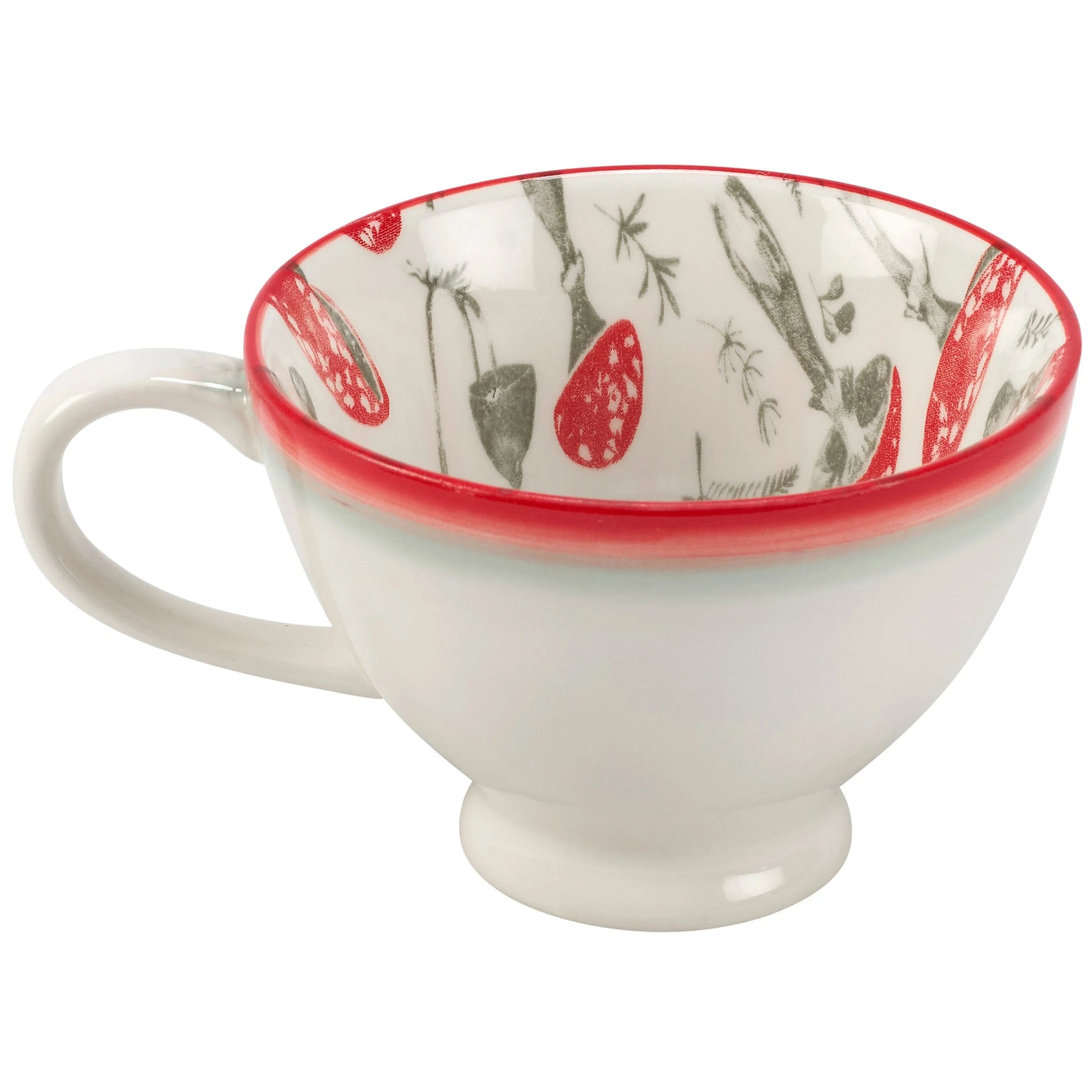 Ceramic cup with red interior and floral pattern on a white background