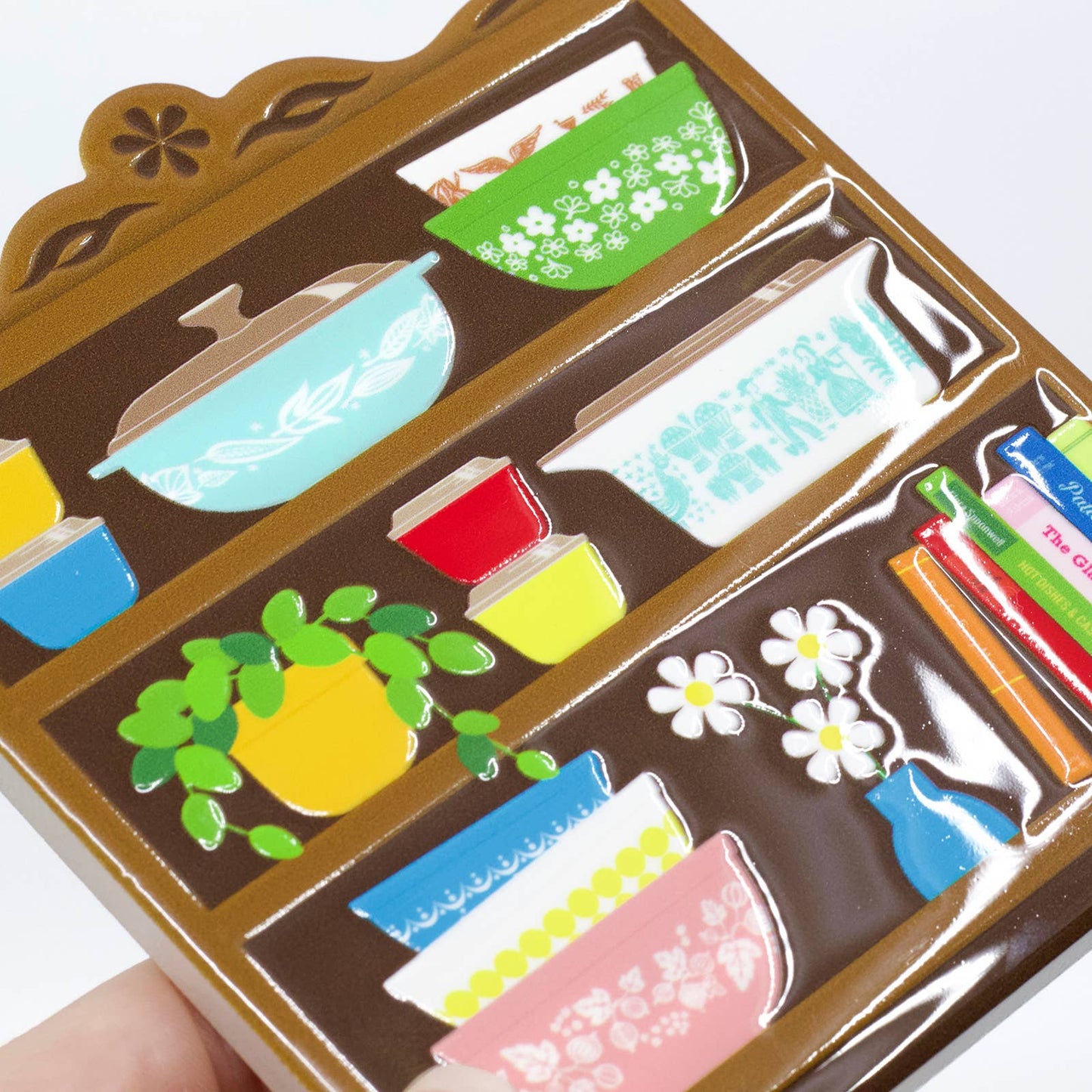 Colorful ceramic miniature items on a coaster