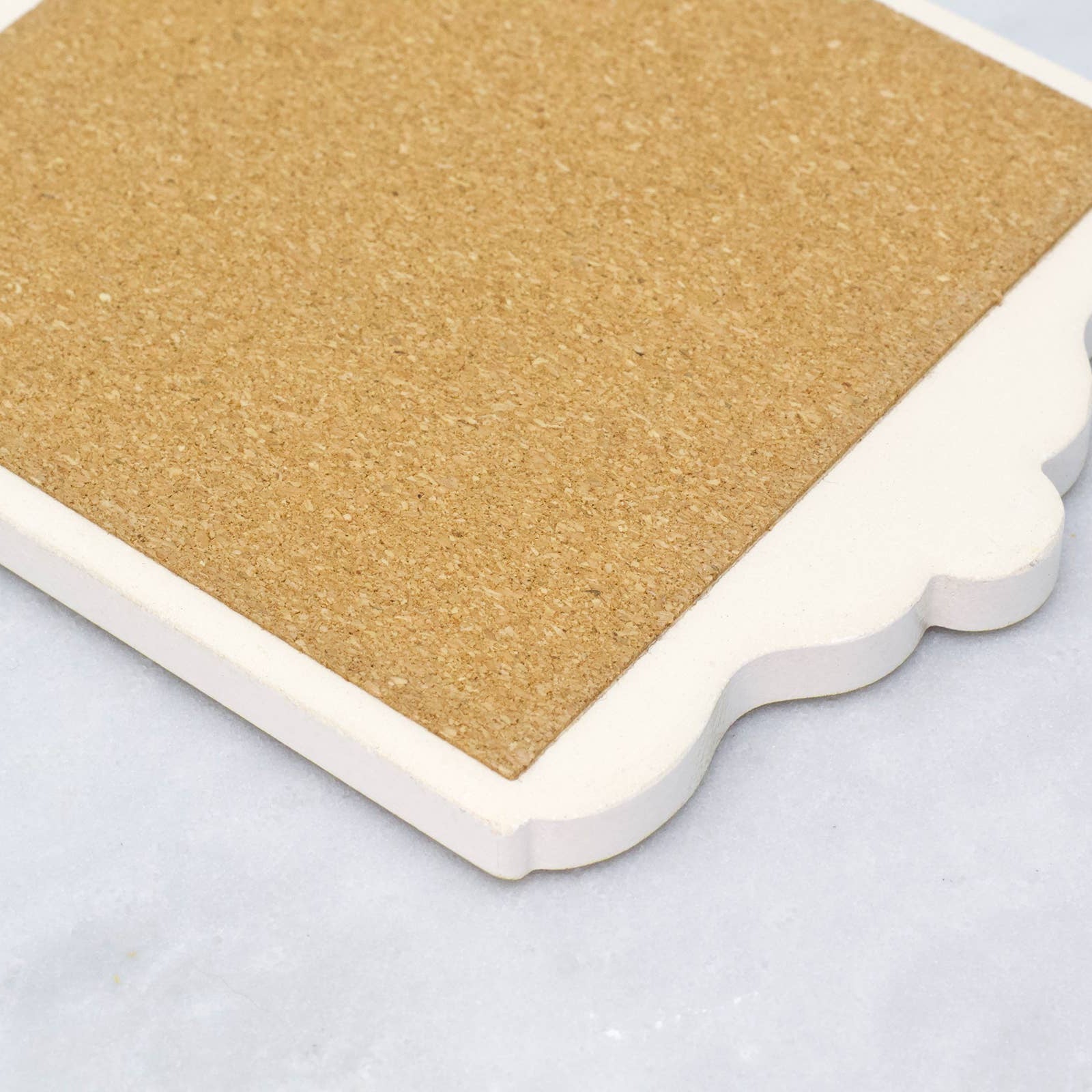 Close-up of the back of a coaster made of cork board