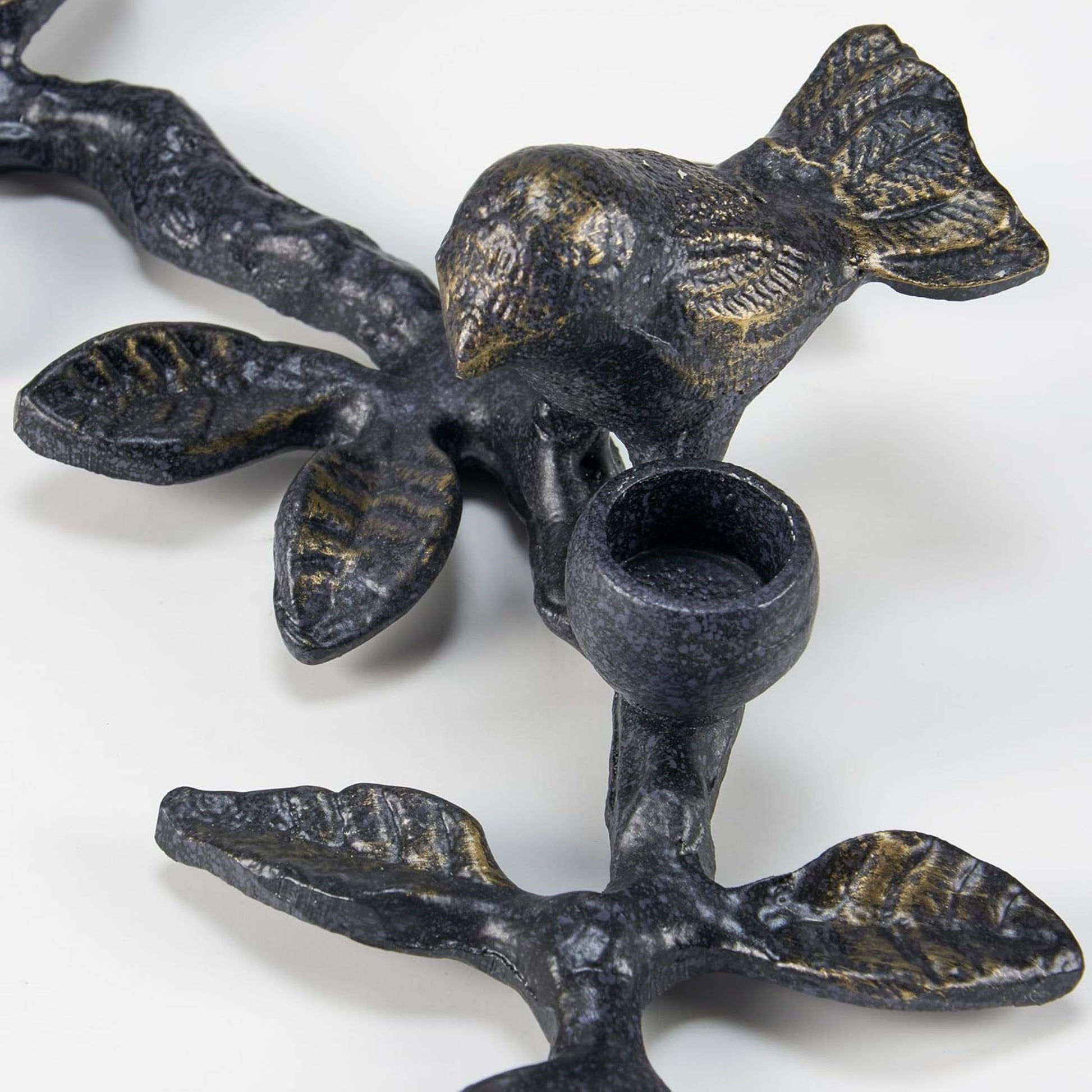 Decorative metal candle holder with bird and leaf design 