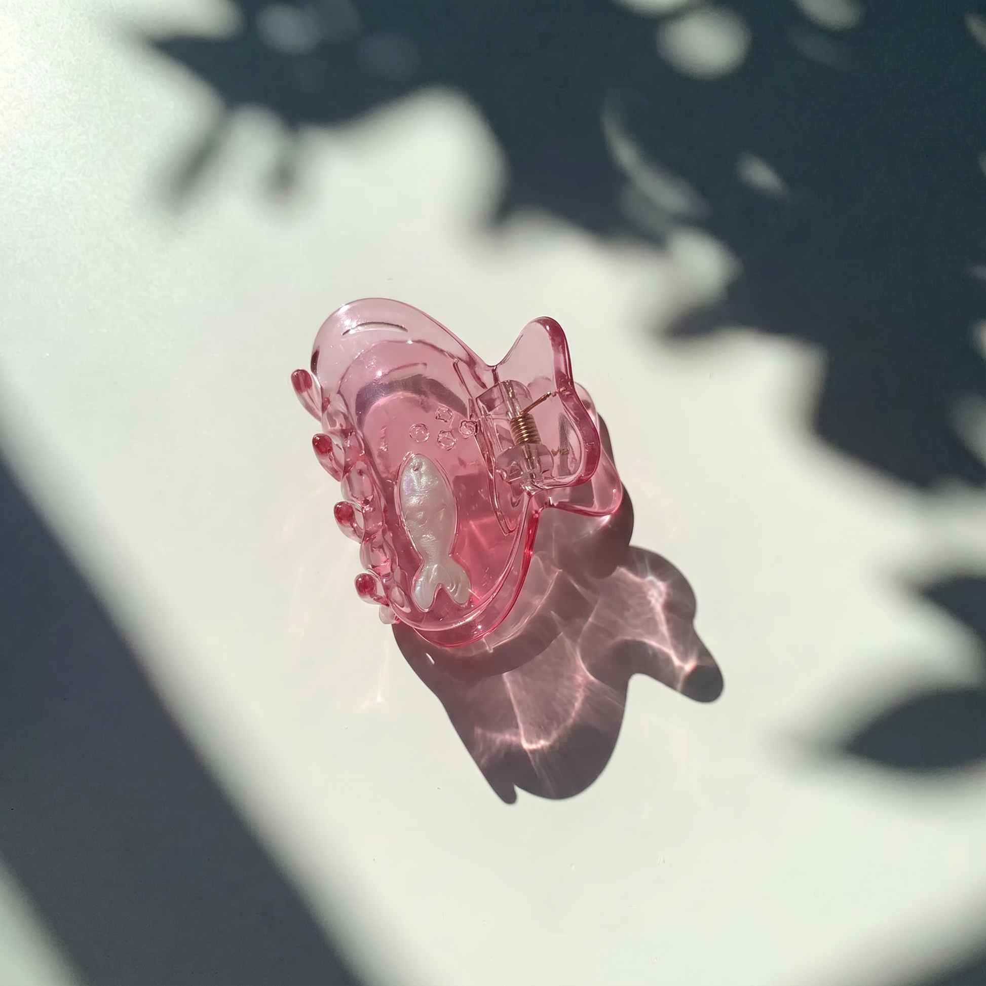 School of One Mini Fish Hair Claw in Translucent Pink