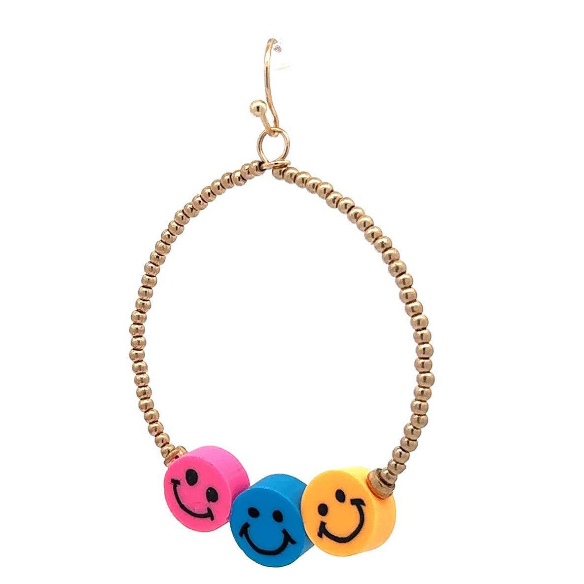 Earring with smiley face charms on a beaded hoop