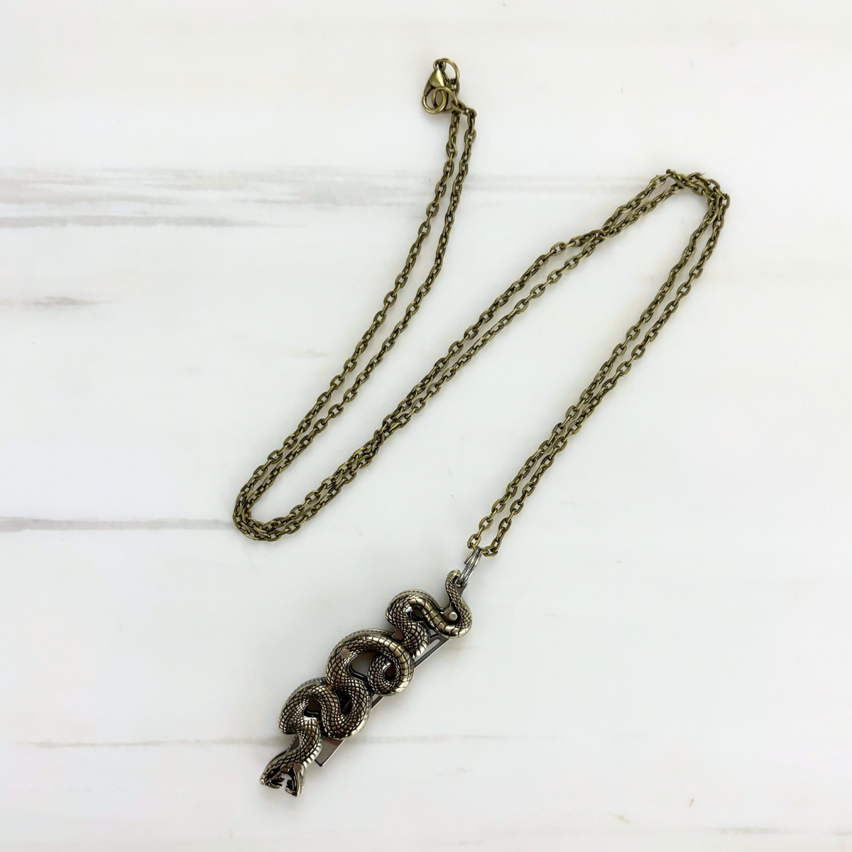 Snake Knife Necklace in Bronze | Folding Knife Pendant | GetBullish