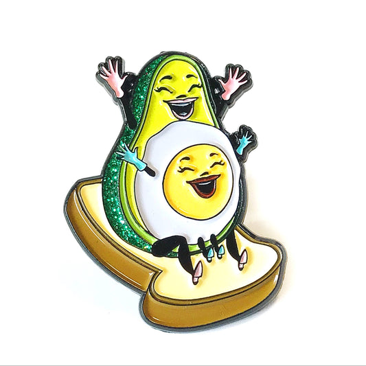 Avocado character enamel pin with a smiling face