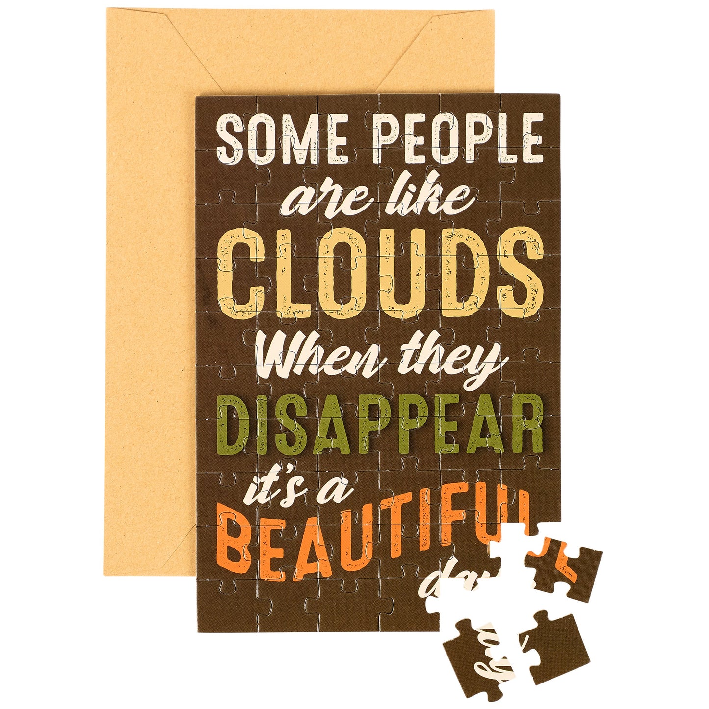 Greeting card with puzzle and quote 'Some people are like clouds when they disappear it's a beautiful' on brown background