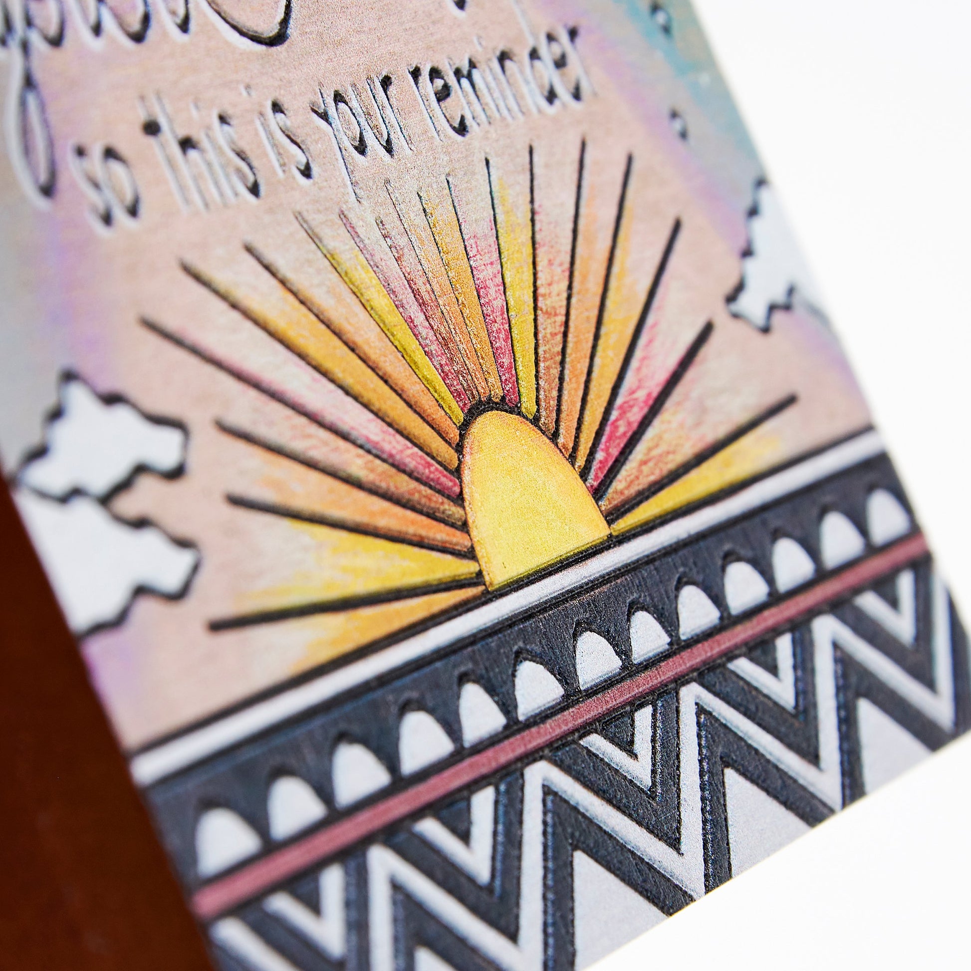 Card with sun design and text 'so this is your reminder' on a white background