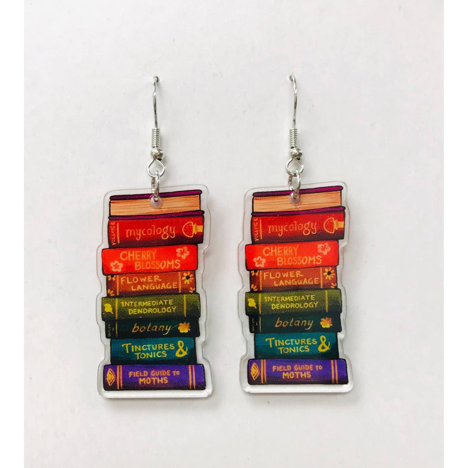 Stacked book-themed earrings