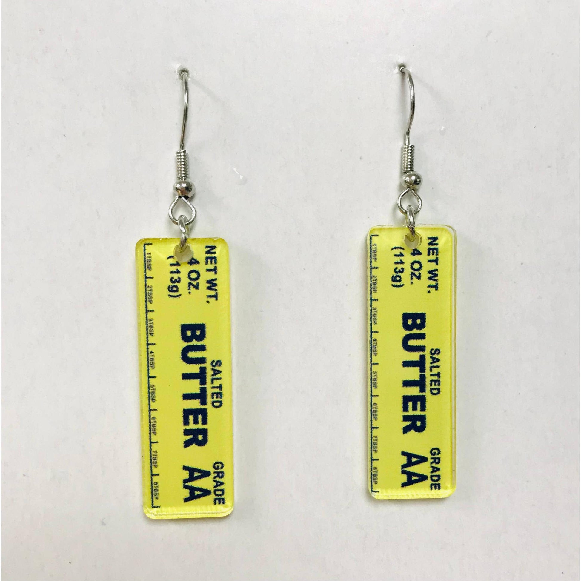 Butter container label earrings on a white background