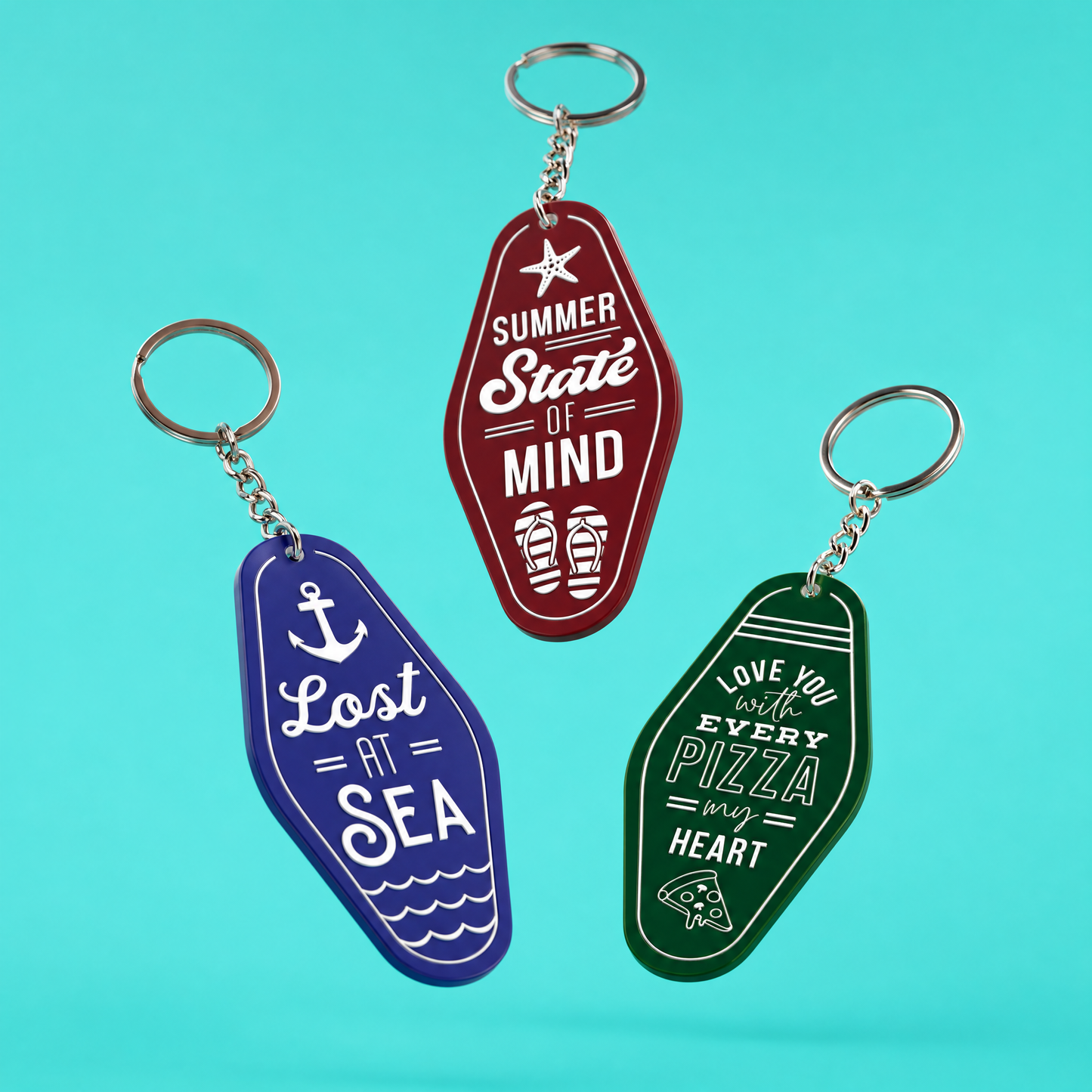 Three colorful summer themed 
keychains with text on a turquoise background