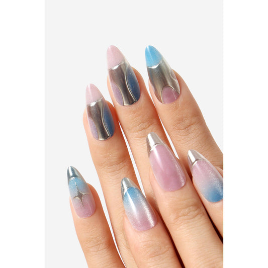A close-up of a hand with long stiletto-shaped nails painted in a pastel gradient design. The nails feature a mix of metallic silver, light pink, lavender, blue, and white gradient patterns, with metallic silver tips.