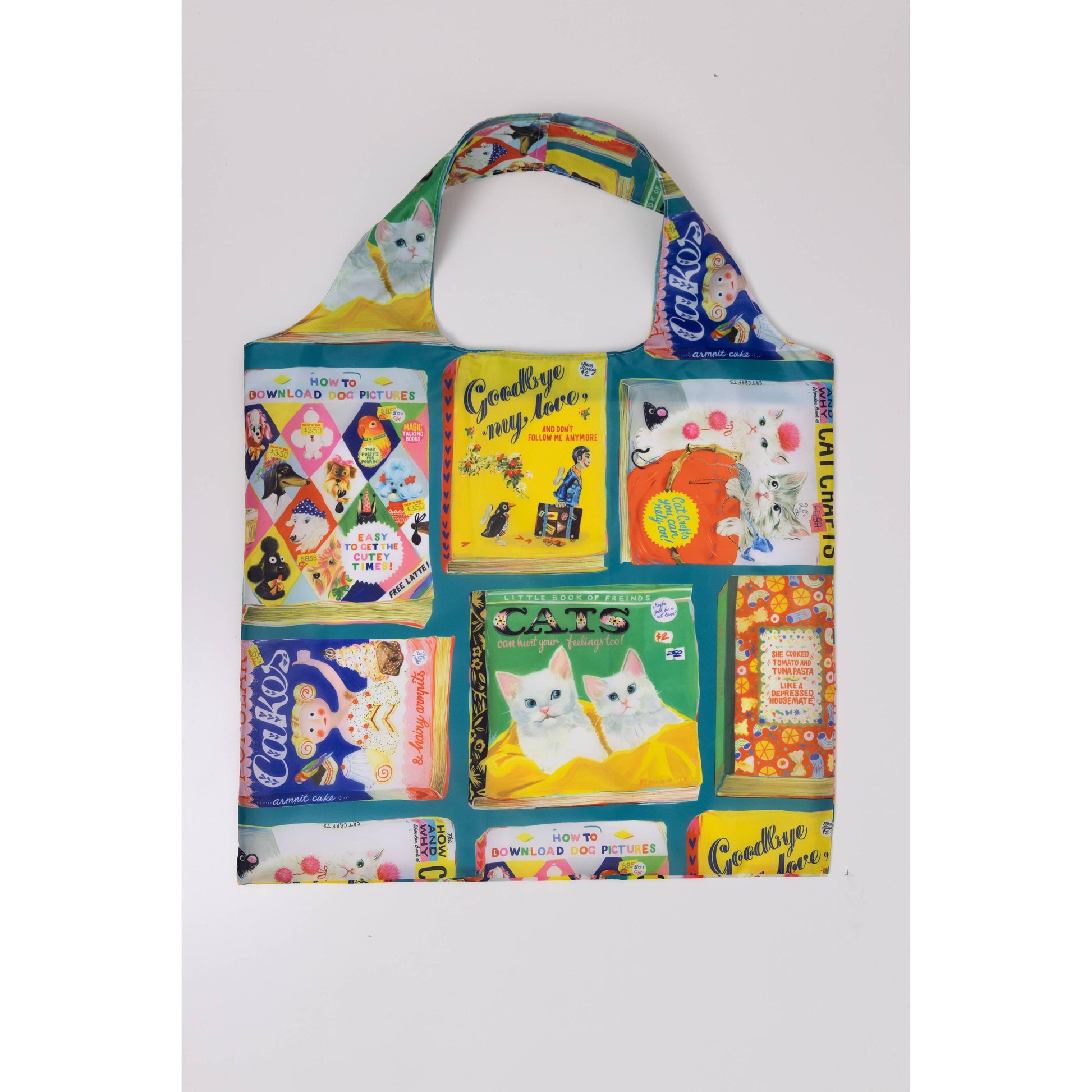 Colorful tote bag with book-themed design on a white background