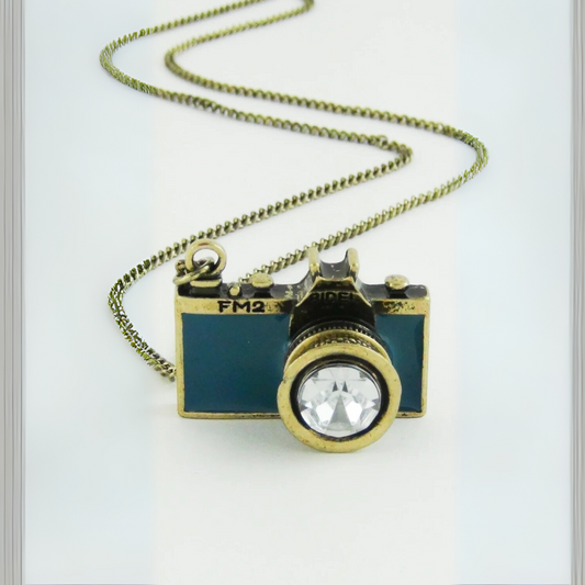 Camera-shaped pendant necklace on a white background