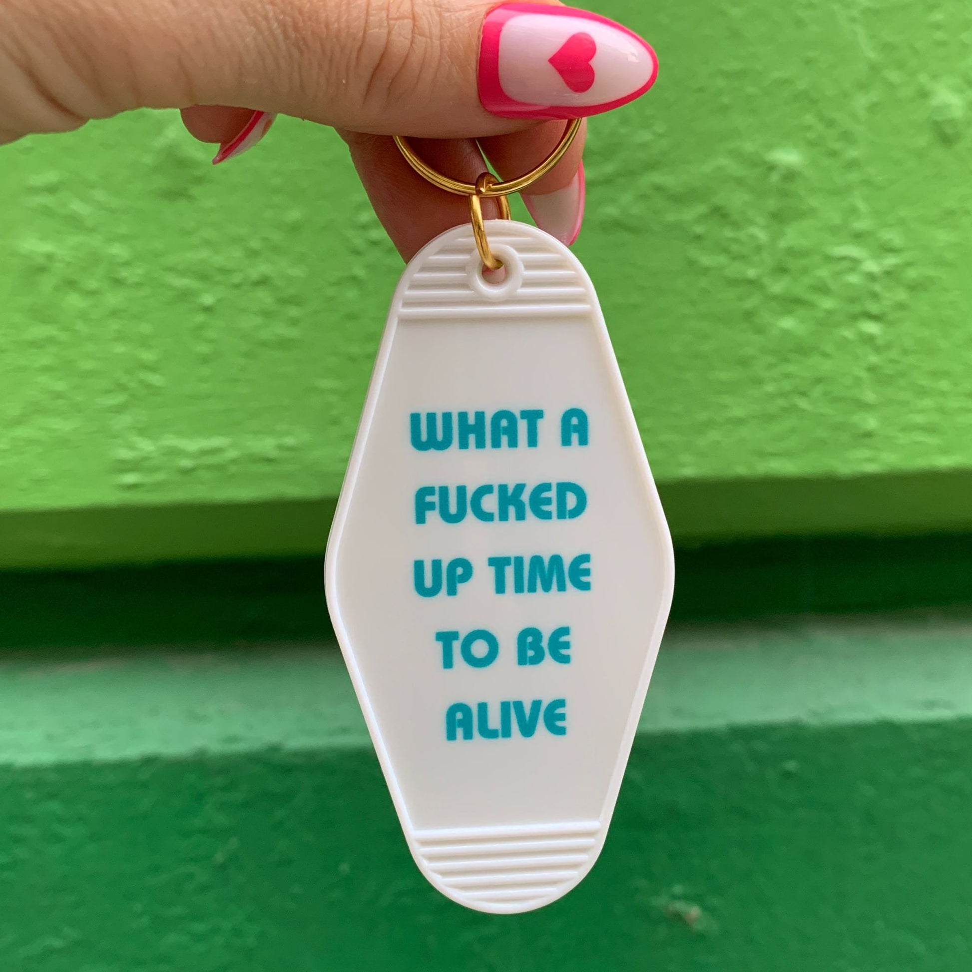 What a Fucked Up Time to Be Alive Motel Style Keychain in White