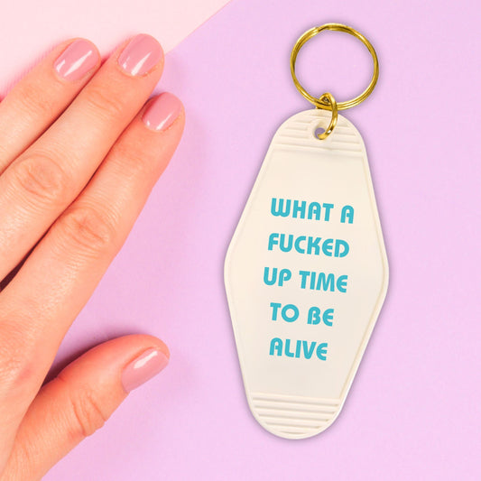 What a Fucked Up Time to Be Alive Motel Style Keychain in White