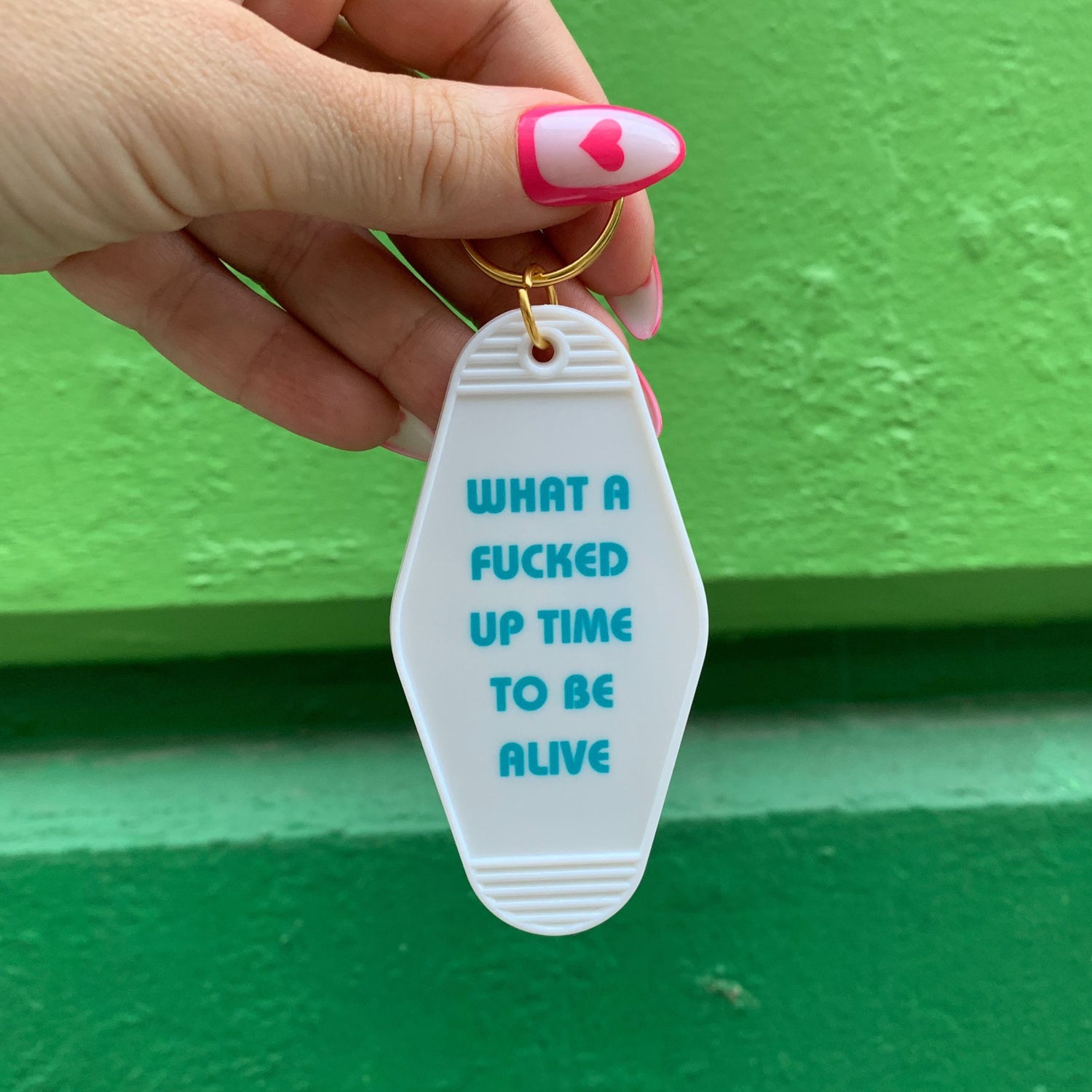 What a Fucked Up Time to Be Alive Motel Style Keychain in White