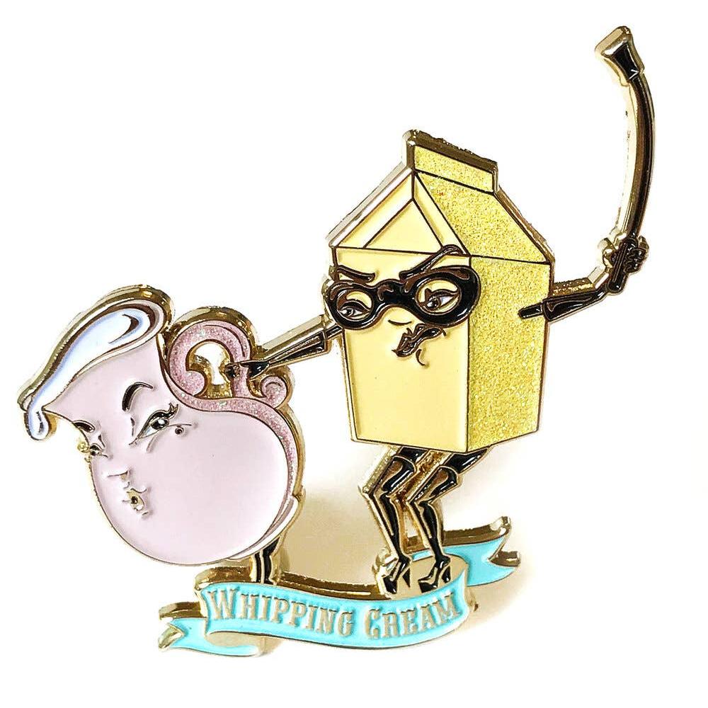 Whipping cream in metallic gold and pink character with a box on its head, resembling a cartoon or animated design.