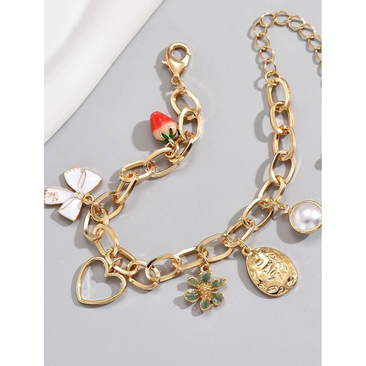 White Coquette Bow Strawberry Pearl Multi Charm Bracelet in Gold Plating | 7" Long