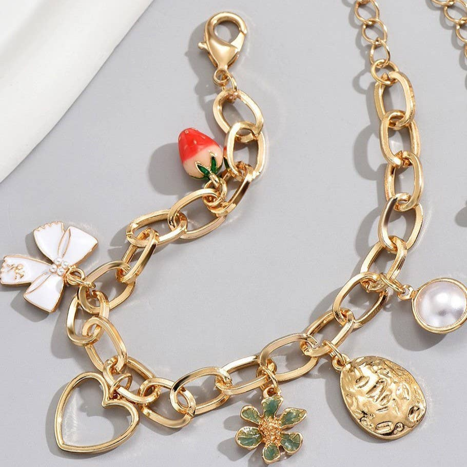 White Coquette Bow Strawberry Pearl Multi Charm Bracelet in Gold Plating | 7" Long