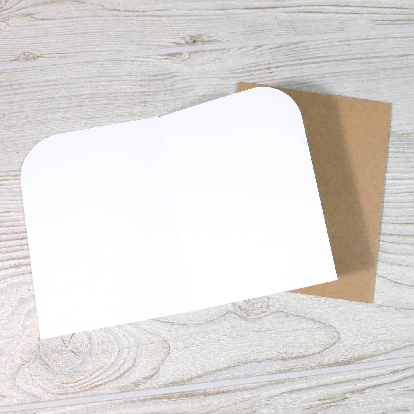 Inside of a blank greeting card with brown envelope