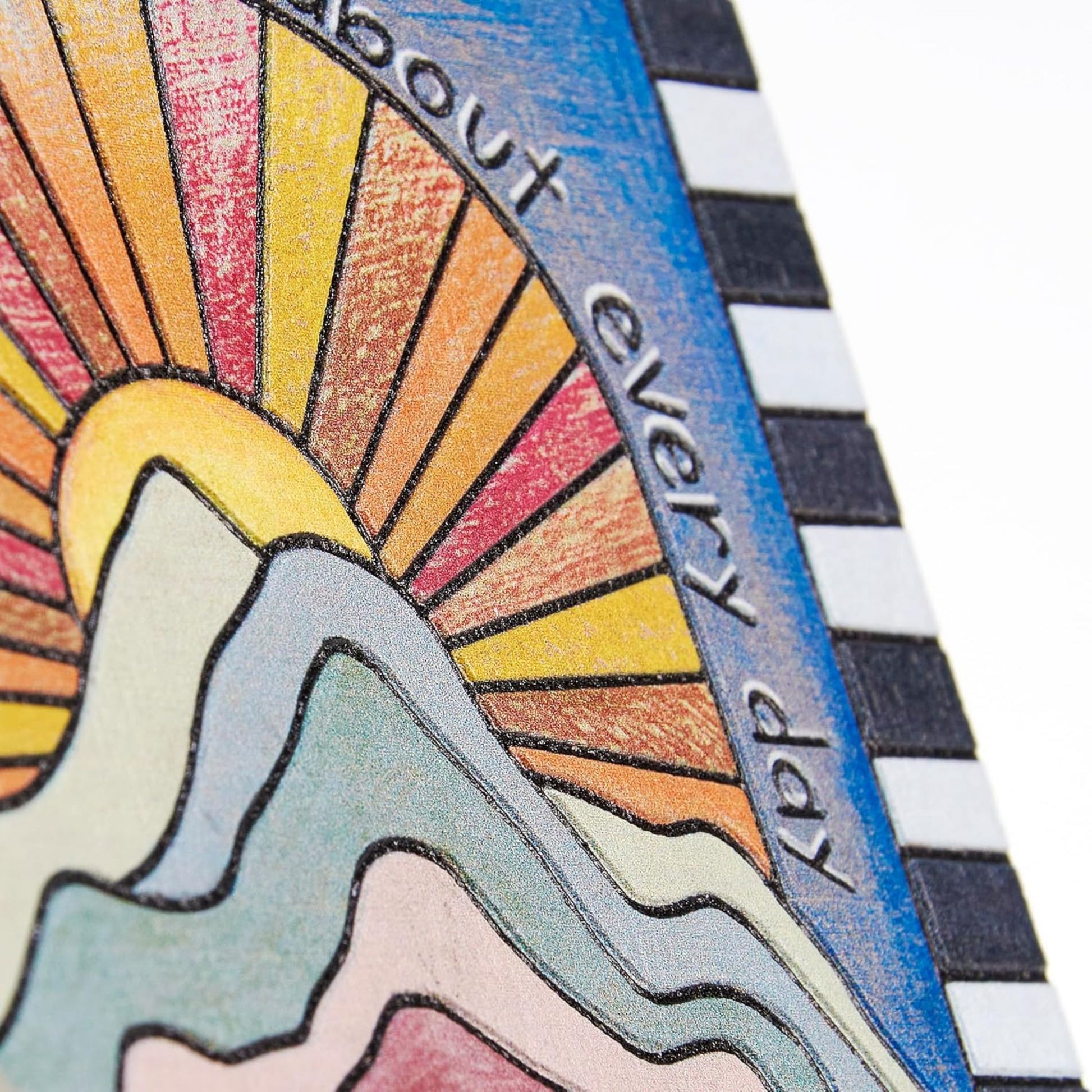 Colorful illustration of a mountain and sun with text on a striped background