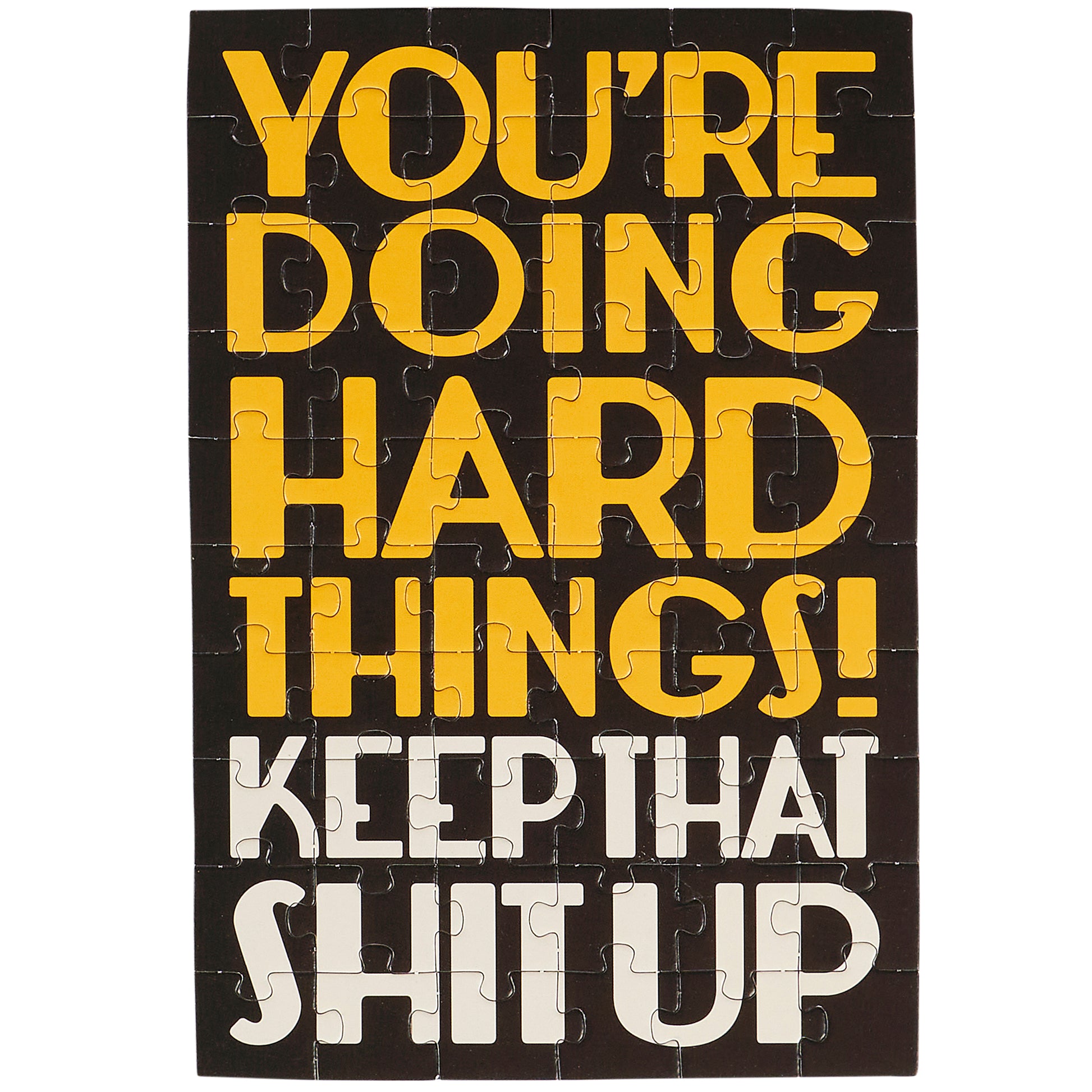 Jigsaw puzzle with motivational text on a black background