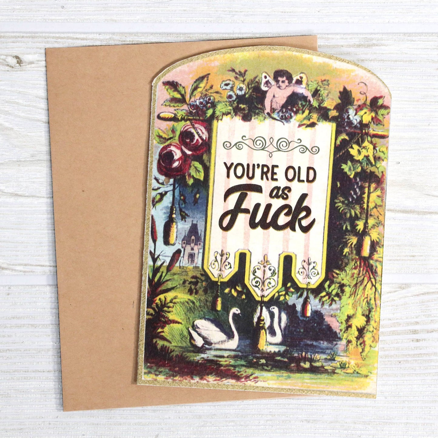 Greeting card with vintage-style illustration and text on a wooden surface