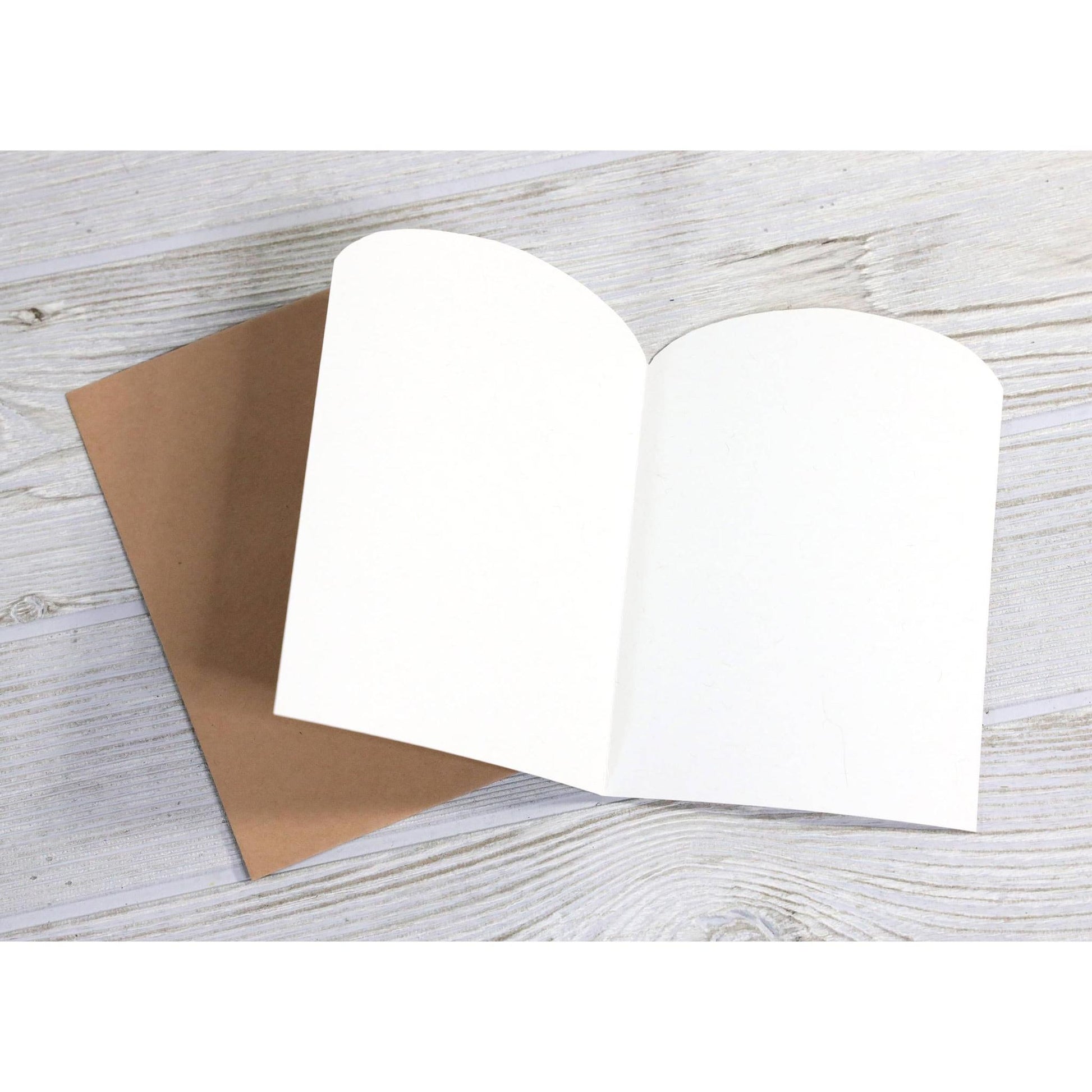 Inside of a blank greeting card with brown envelope