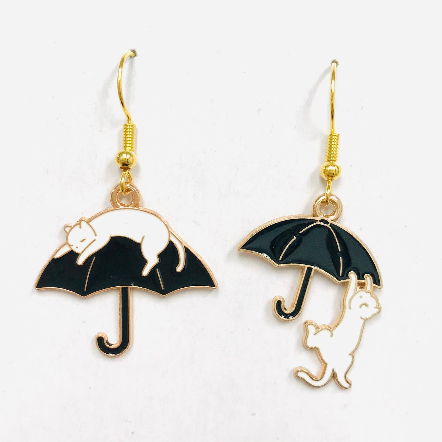 Cat climbing an umbrella earrings 