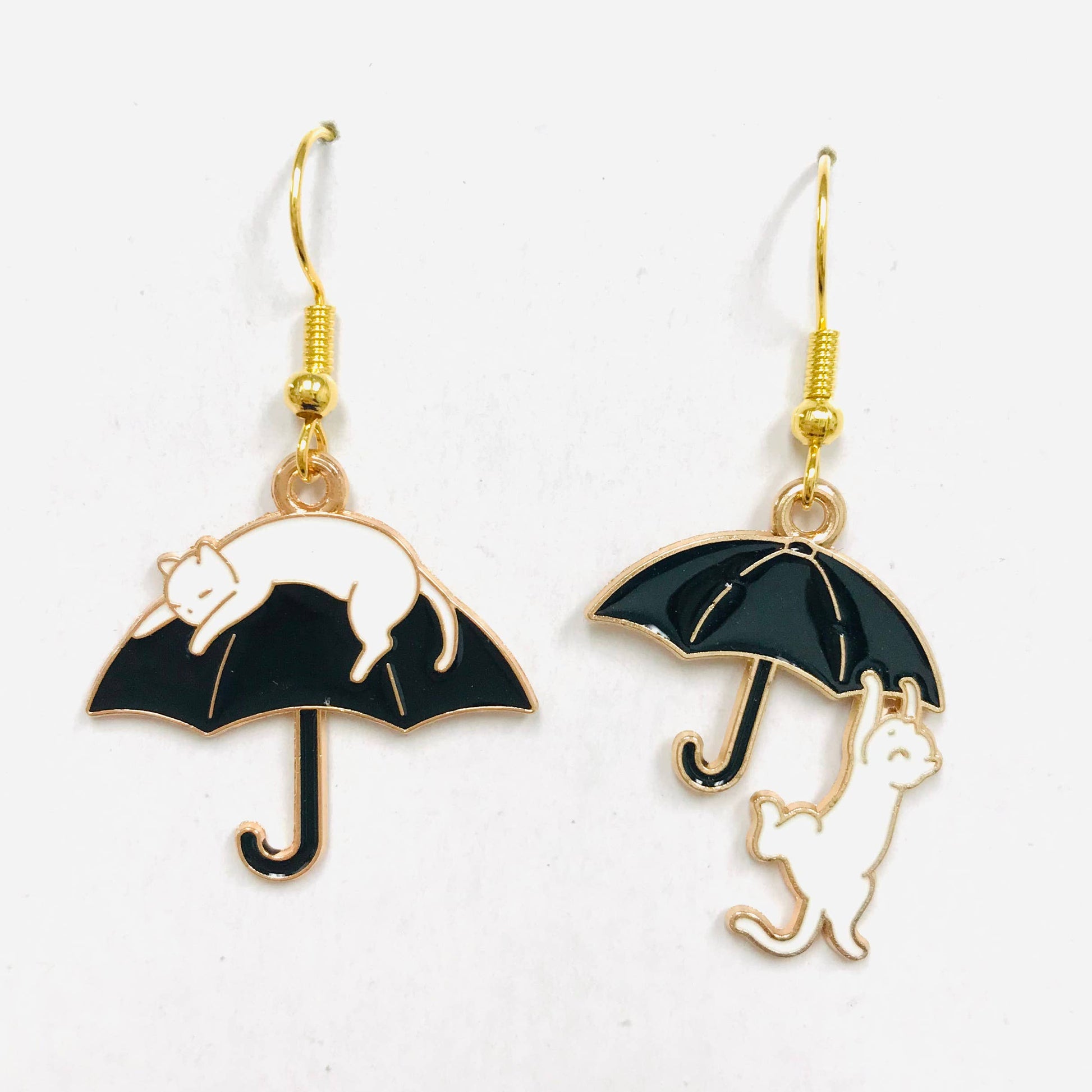 Cat climbing an umbrella earrings 