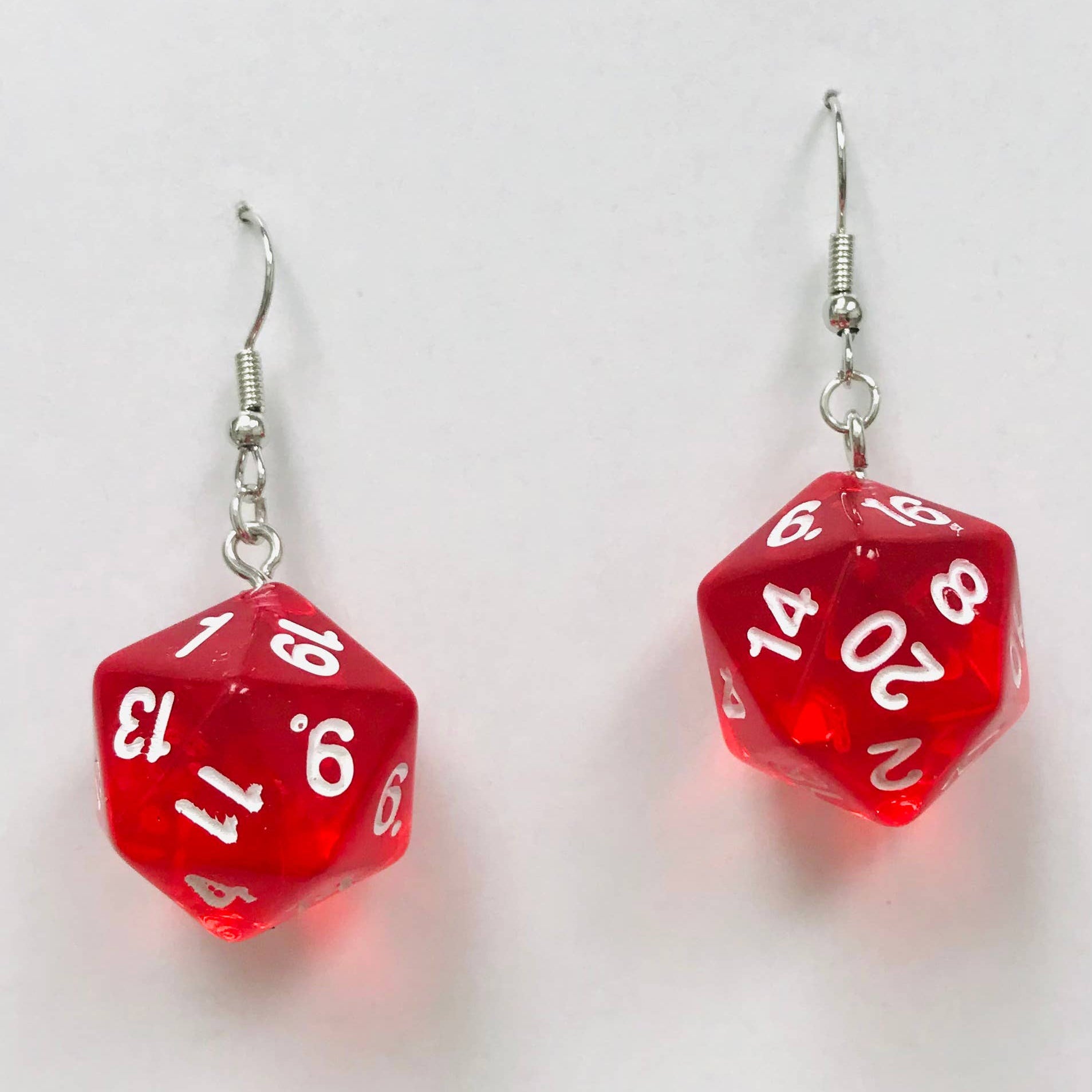 Red dice-shaped earrings with white numbers 