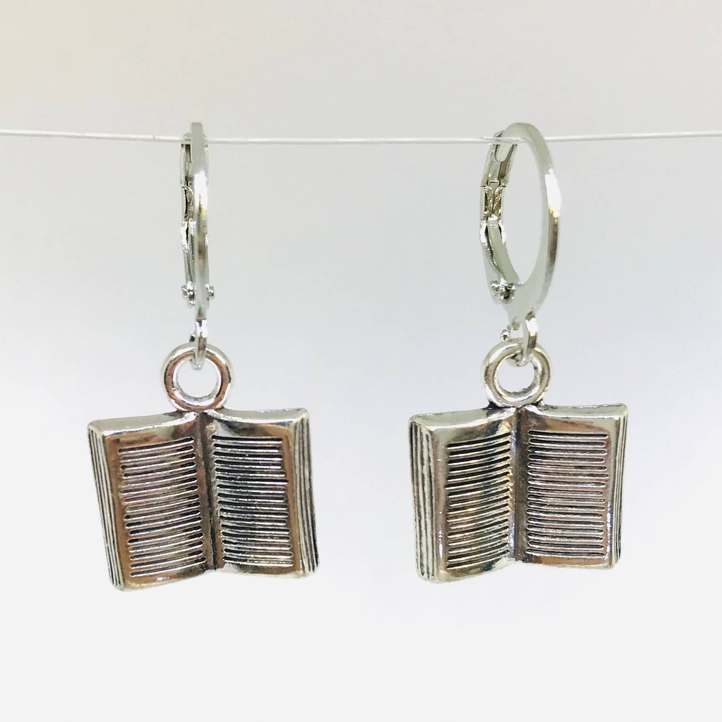 Silver book-shaped earrings
