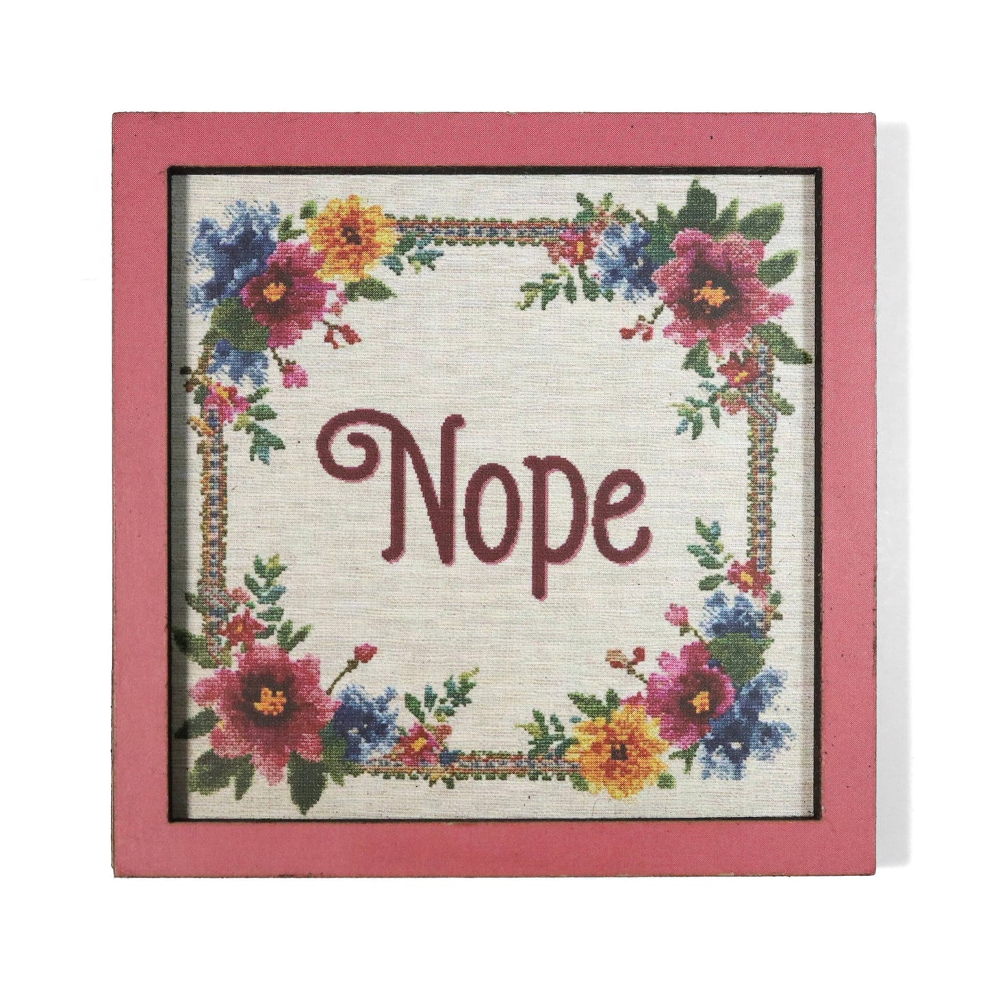 Cross-stitched style magnet with phrase 'Nope' surrounded by floral patterns in a pink frame.