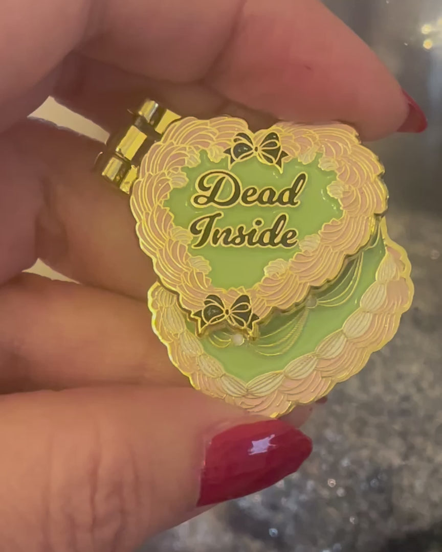 Moving enamel pin with cake halloween-themed design