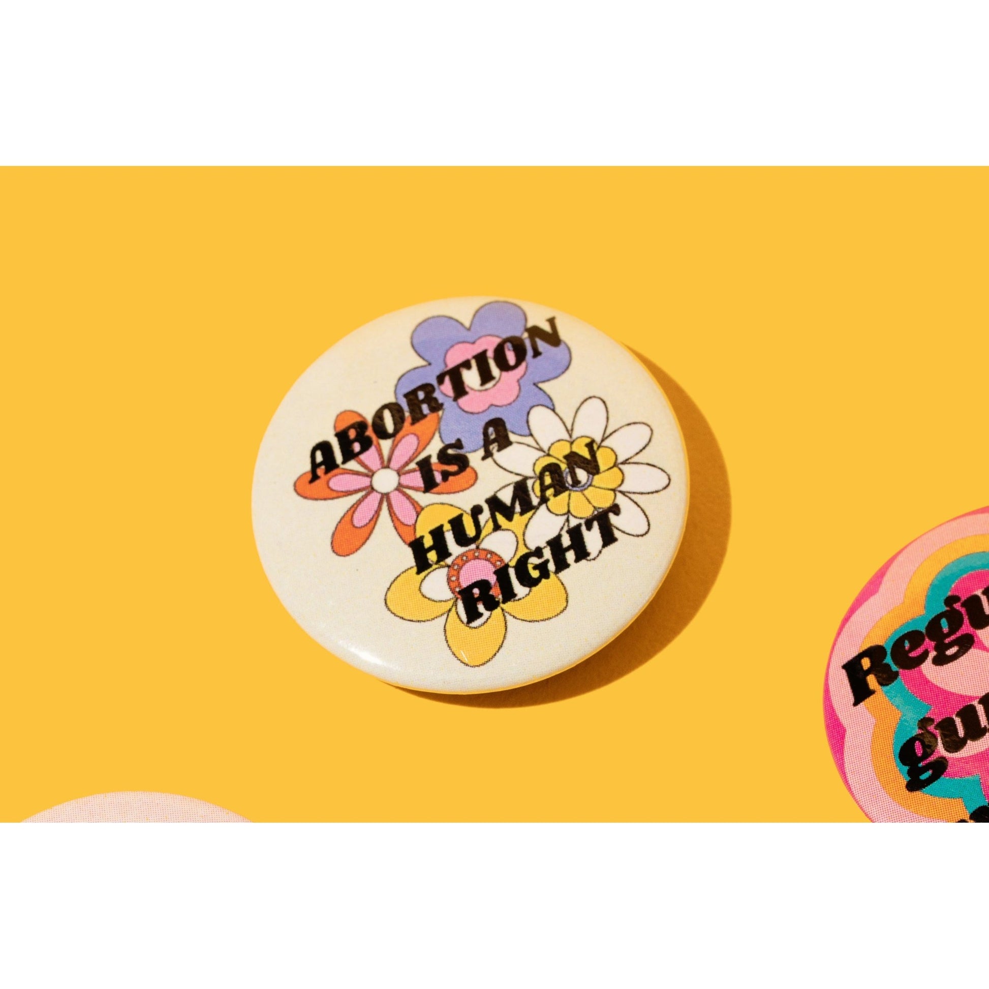 Abortion is a Human Right 1.25" Button in Groovy Flower Design