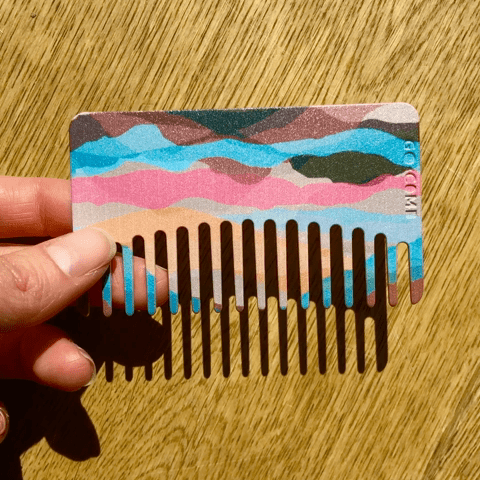 GIF of Fun and Functional This plastic Go-Comb will bring a pop of color and design delight to your wallet.